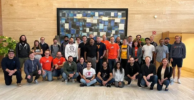 Metrika team photo from 2022 showing all team members in office setting